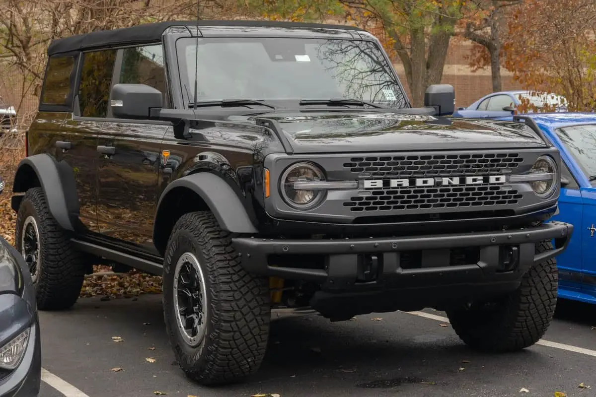 photo of a black ford bronco car parked in a parking lot