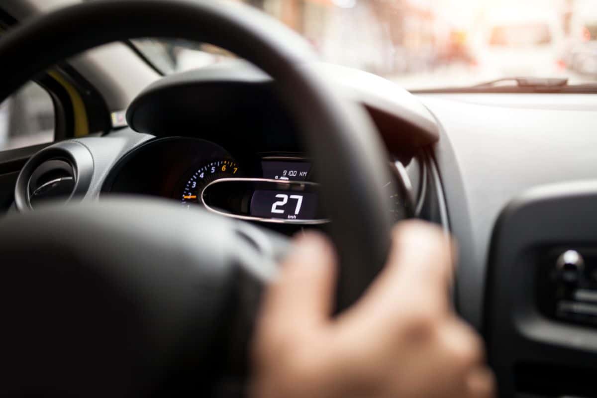 photo of interior of an electric car showing steering wheel and dashboard