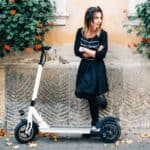 girl-with-electric-scooter-with-flat-battery