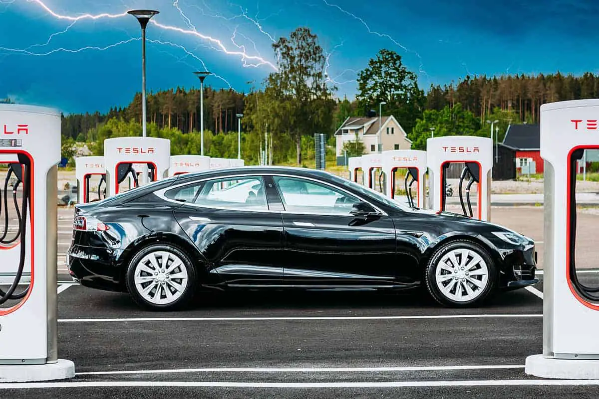 solid black tesla model s at charging station