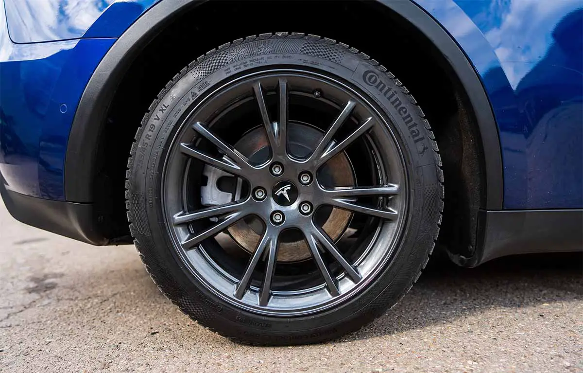 tesla blue metallic model y with gemini wheels