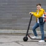 young-teenager-on-electric-scooter-smiling