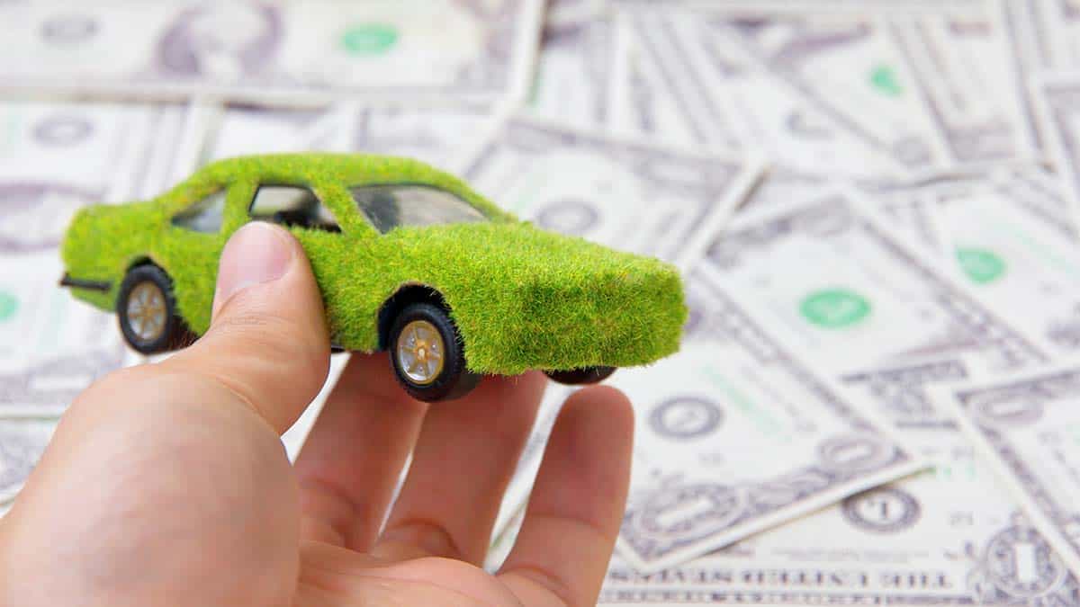eco-car-icon-with-money-in-background
