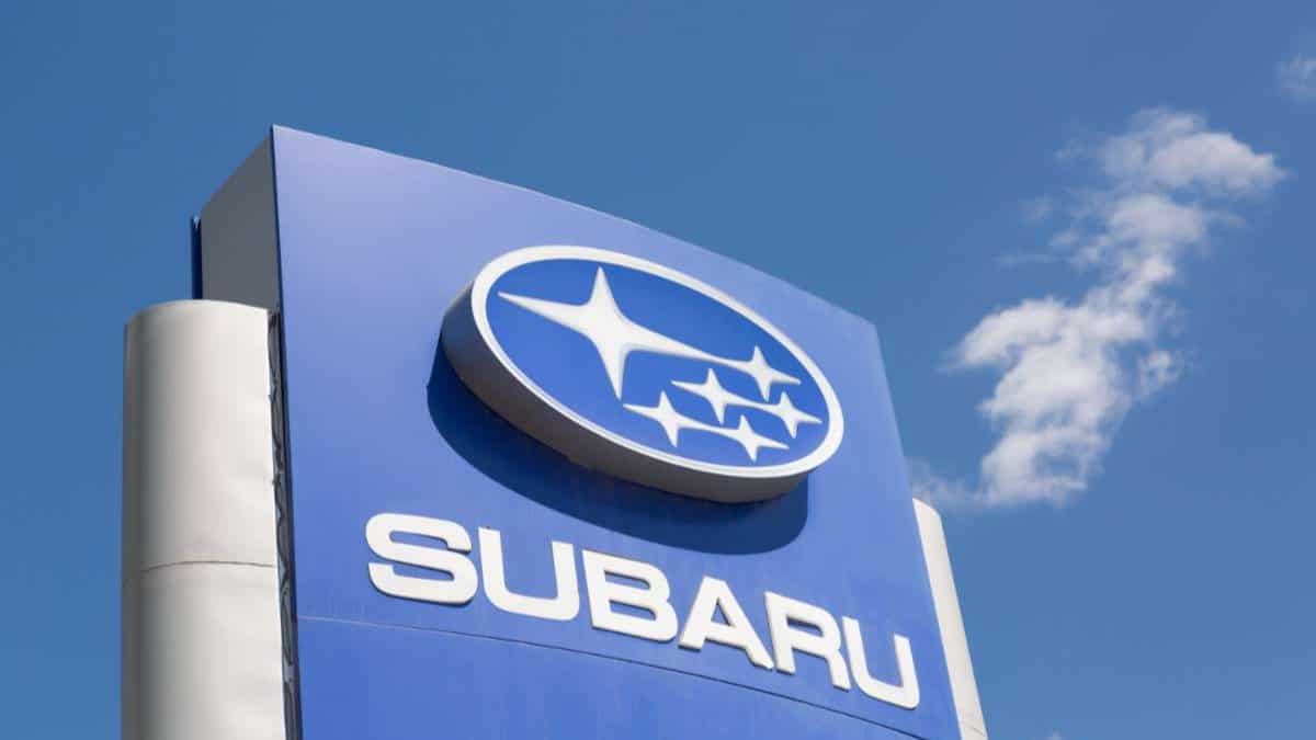 Subaru automobile dealership Sign against blue sky