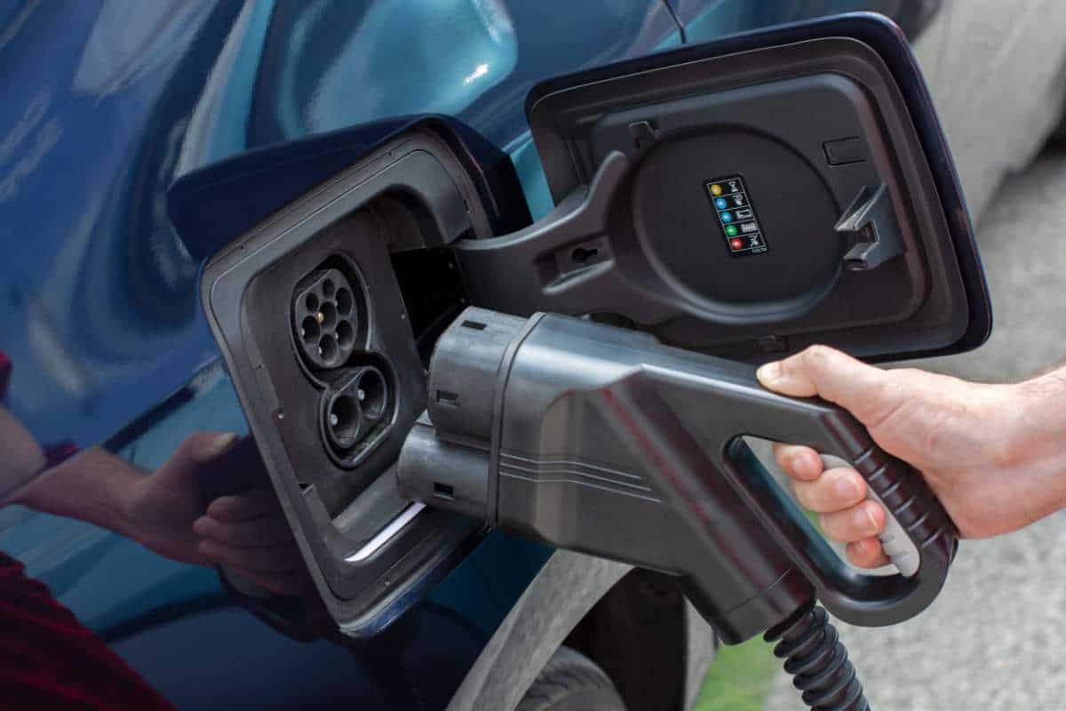 plugging in electric car to be charged