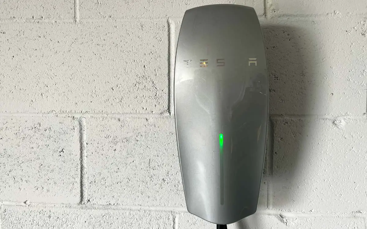 A Tesla wall mounted charging unit in a home