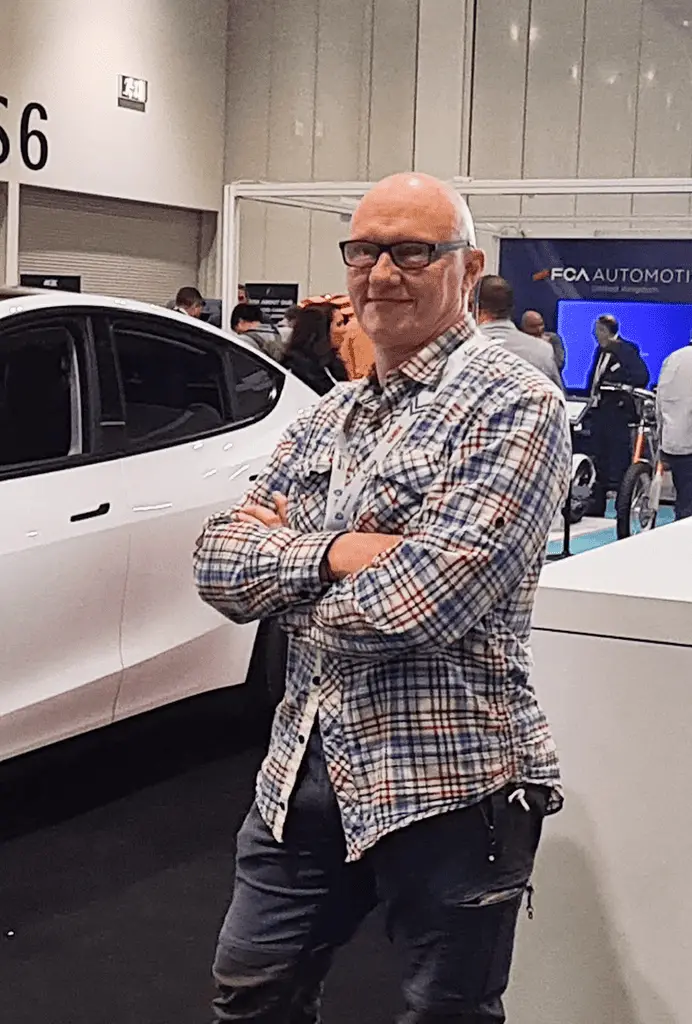 jonathan rice at the tesla stand in the london ev show 2022