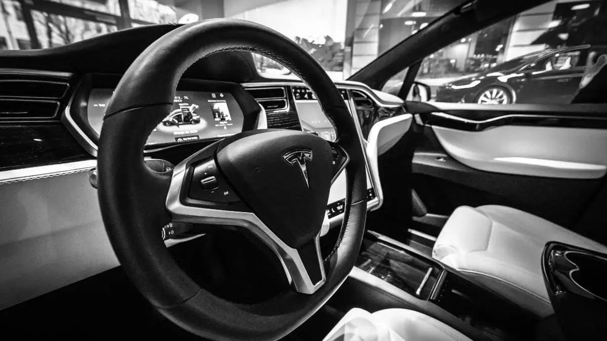 tesla model x interior black and white photo doors open