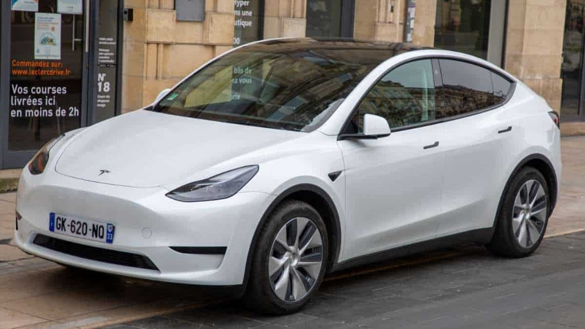 white tesla model 3 parked