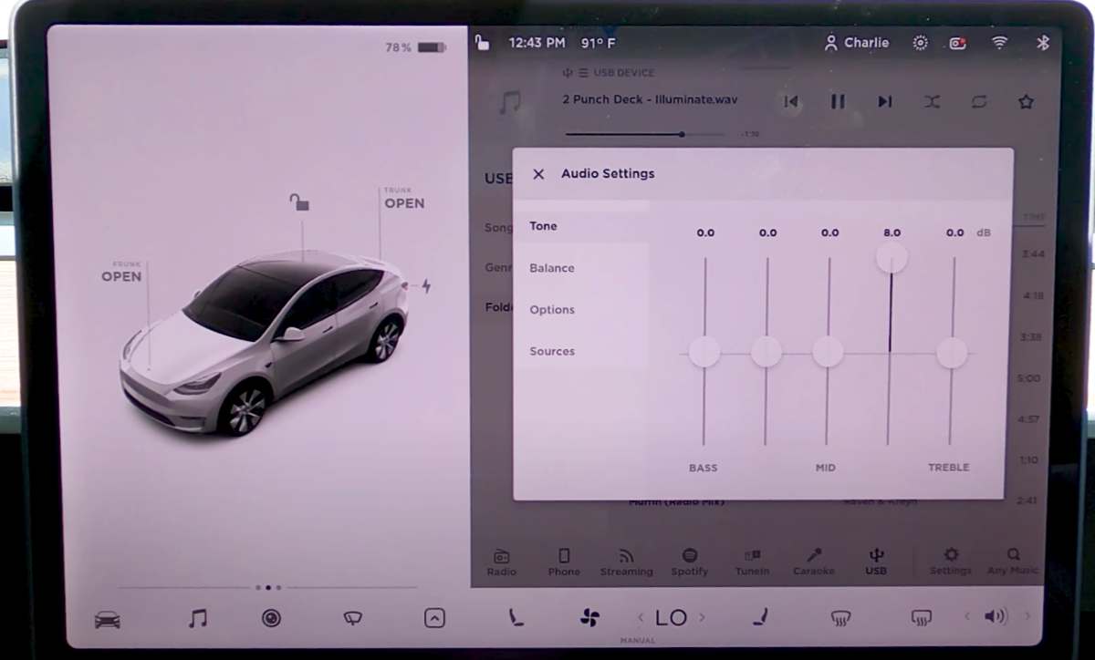 photo of model y sound system touchscreen showing audio customization controls